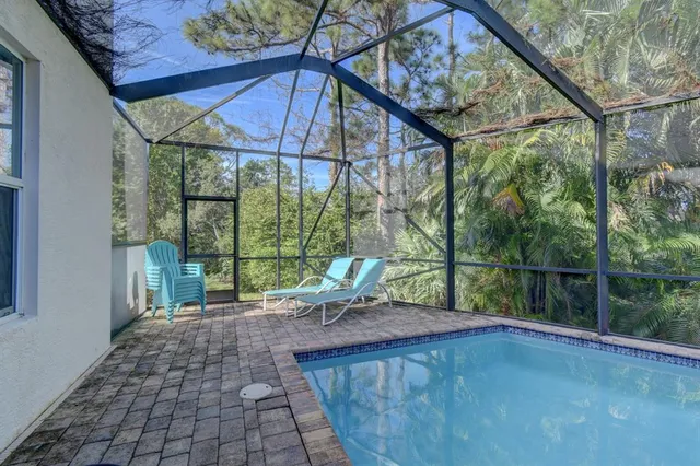 a terrace with outdoor seating and lake view