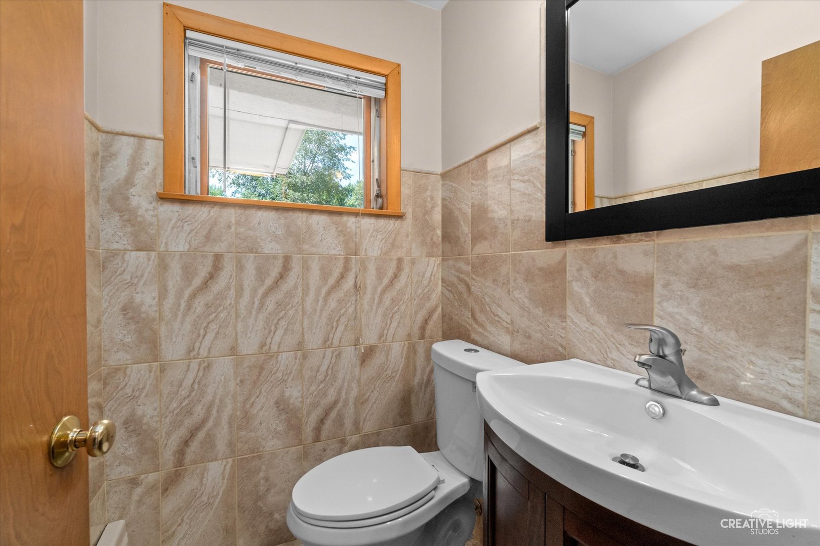 1402 Meadows Road Geneva, IL 60134 - Photo 13 of 30 a bathroom with a sink a toilet and mirror