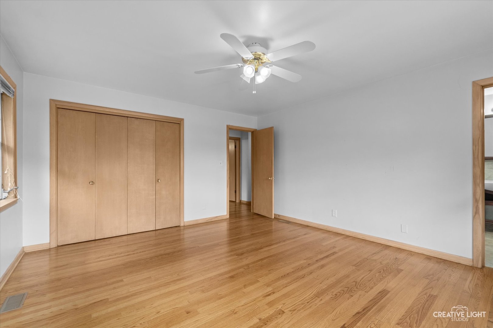1402 Meadows Road Geneva, IL 60134 - Photo 16 of 30 a view of an empty room with wooden floor