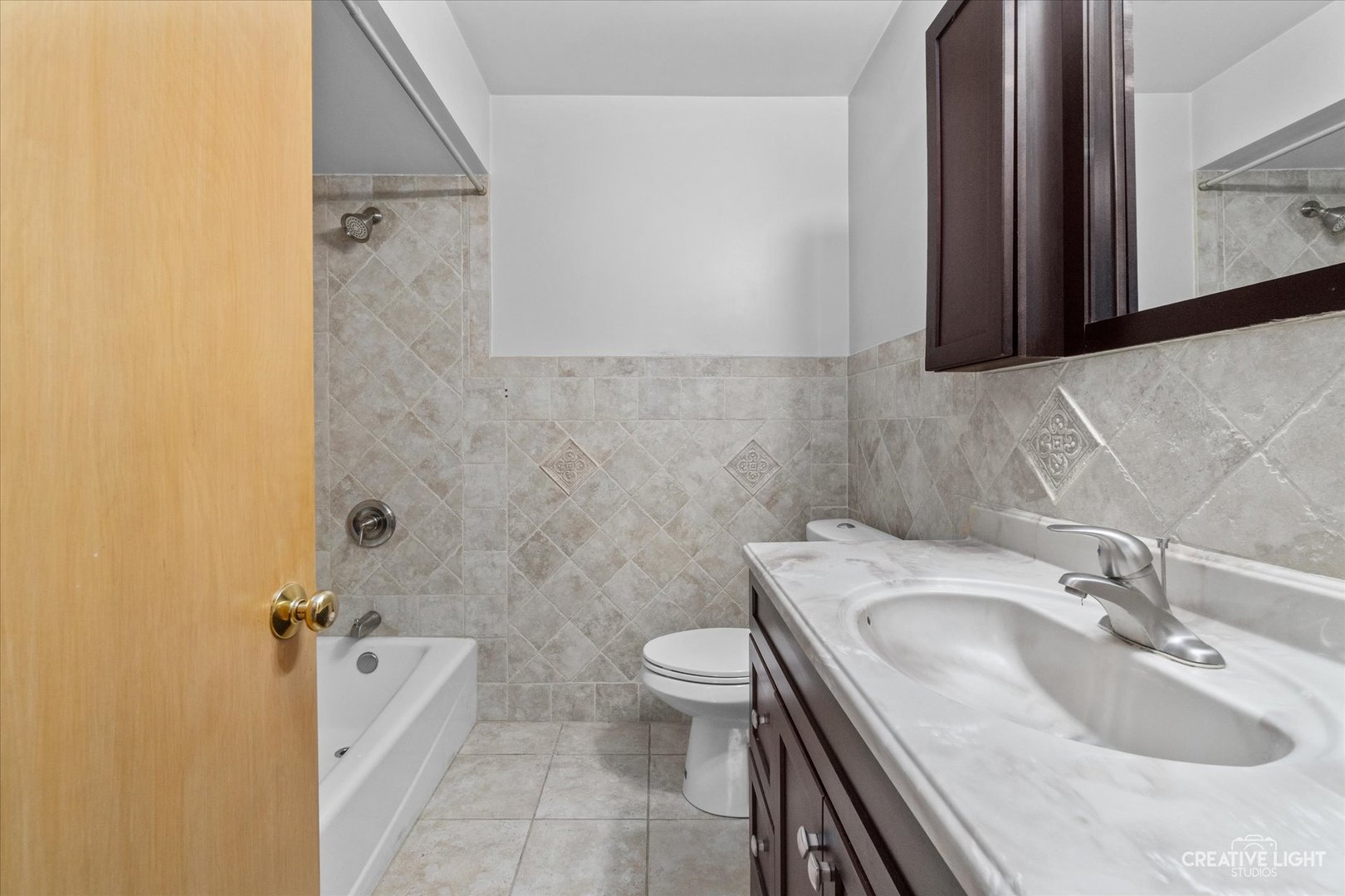 1402 Meadows Road Geneva, IL 60134 - Photo 18 of 30 a bathroom with a sink a toilet and shower
