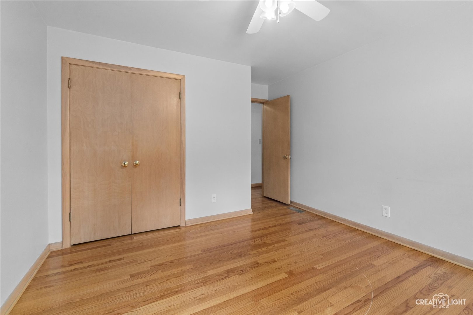 1402 Meadows Road Geneva, IL 60134 - Photo 20 of 30 a view of an empty room with wooden floor