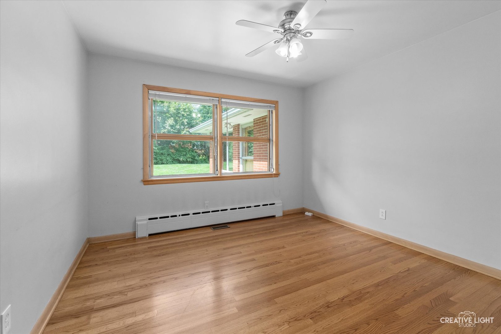 1402 Meadows Road Geneva, IL 60134 - Photo 21 of 30 a view of an empty room with a window