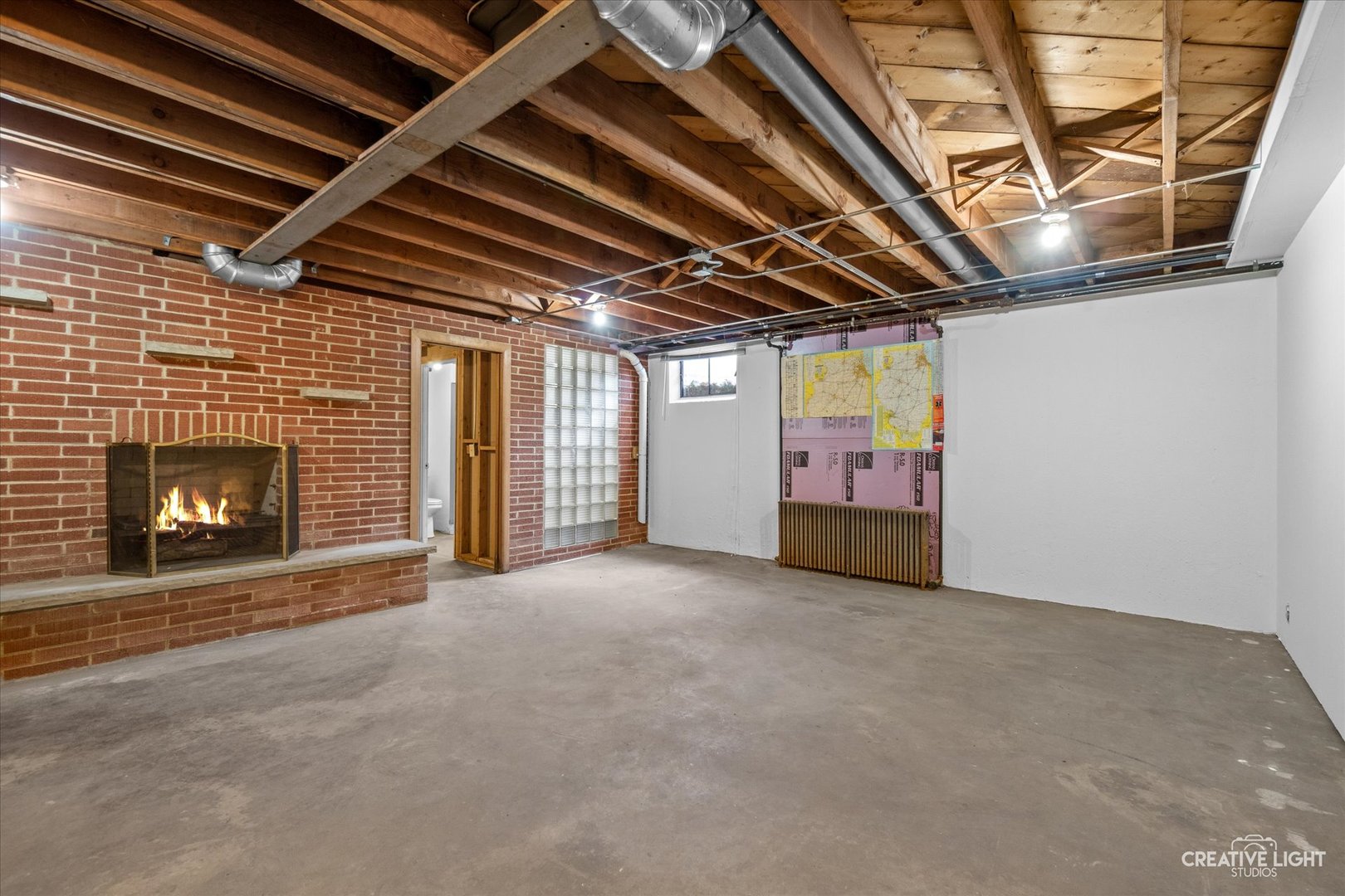 1402 Meadows Road Geneva, IL 60134 - Photo 25 of 30 a view of an empty room with a fireplace