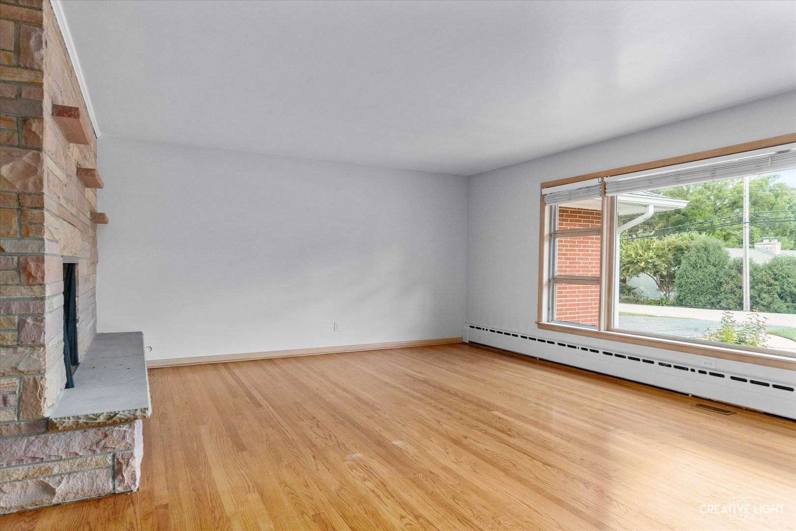 1402 Meadows Road Geneva, IL 60134 - Photo 3 of 30 a view of an empty room with a window