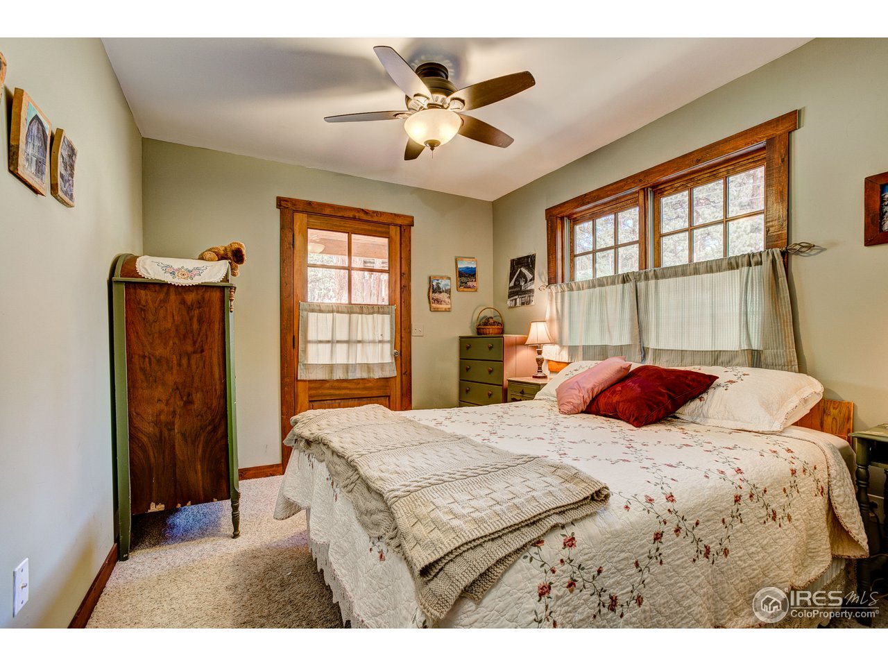 2112 Eagle Cliff Road Estes Park, CO 80517 - Photo 14 of 30 a bedroom with a bed and a large window