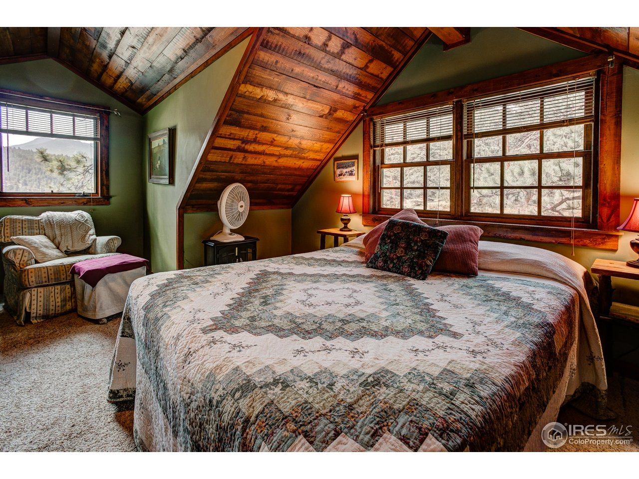 2112 Eagle Cliff Road Estes Park, CO 80517 - Photo 21 of 30 a bedroom with a bed and a large window