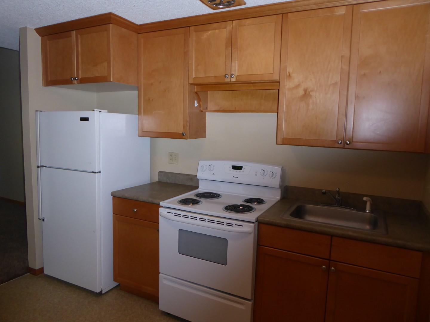 1700 Northeast Wells Acres Road, Unit 15 Bend, OR 97701 - Photo 6 of 17 Efficient kitchen with newer cabinets