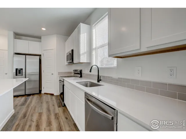 a view of kitchen with wooden floor