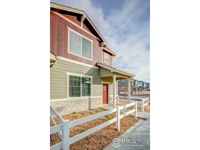 a view of a house with snow on the road