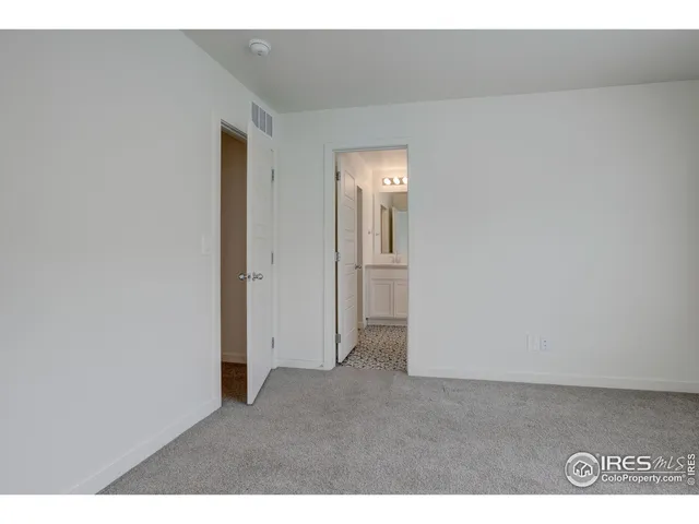 a bathroom with a sink toilet a mirror and vanity
