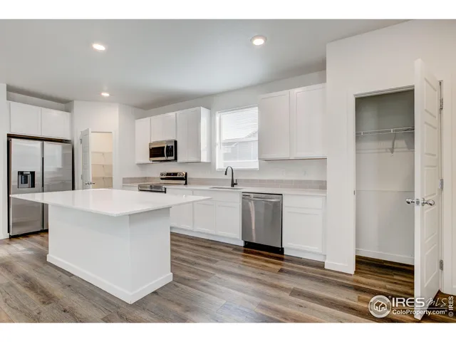 a view of kitchen with wooden floor