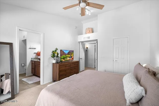 a bedroom with a bed and a dresser