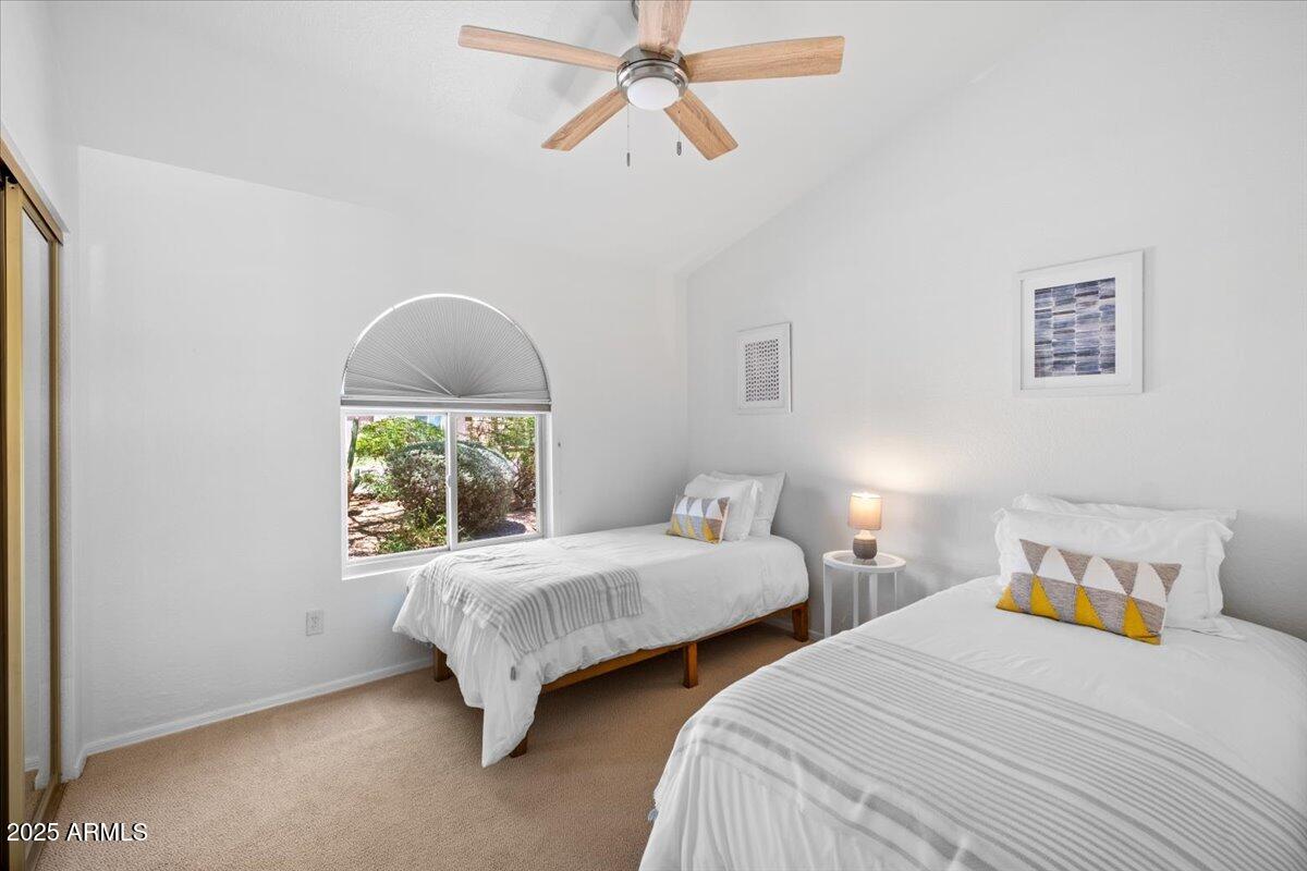 9081 East Sahuaro Drive Scottsdale, AZ 85260 - Photo 18 of 22 a bedroom with two beds and a window