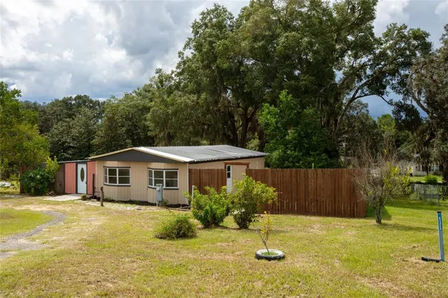 a house with swimming pool in front of it