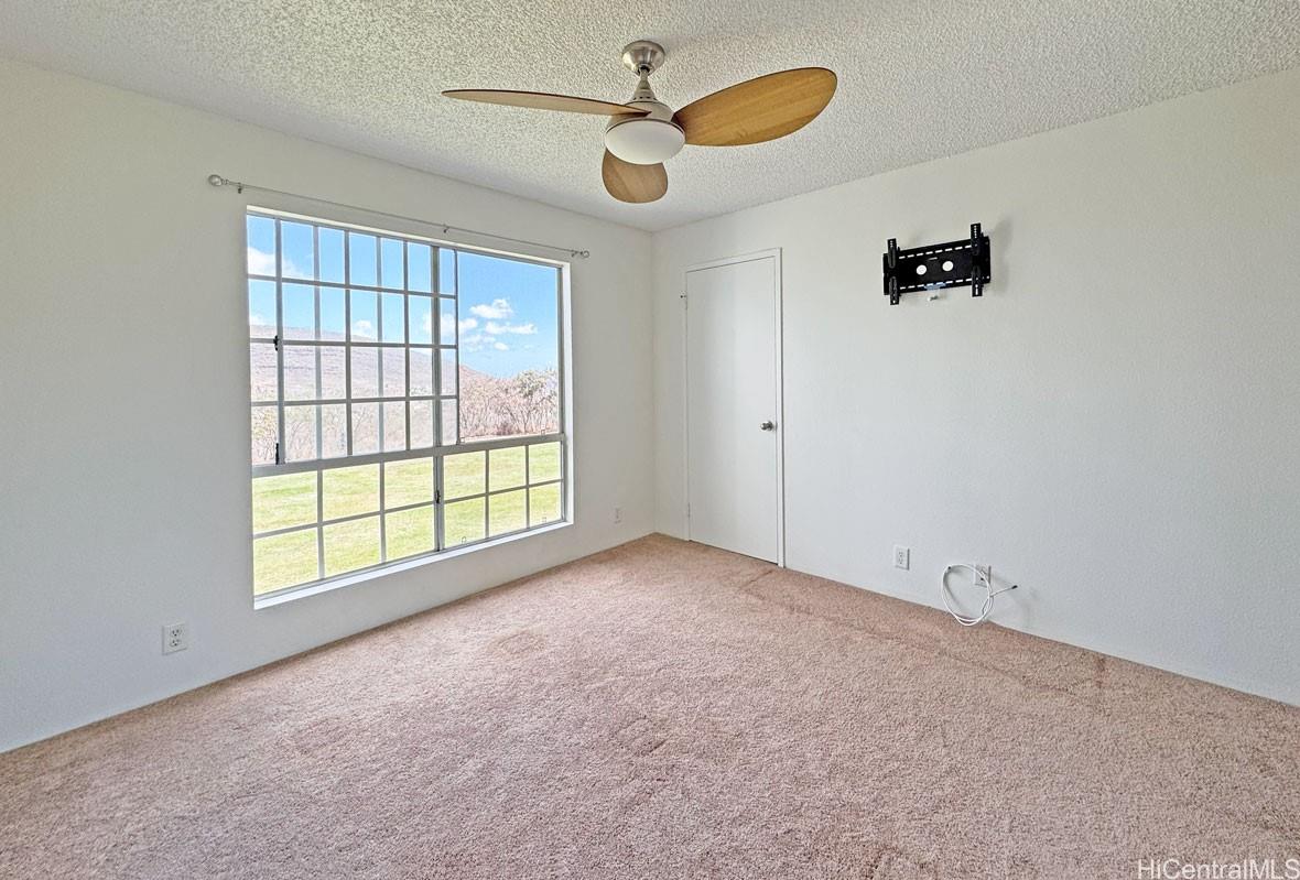 92-1150 Hame Street, Unit 8102 Kapolei, HI 96707 - Photo 14 of 19 a view of an empty room with a window