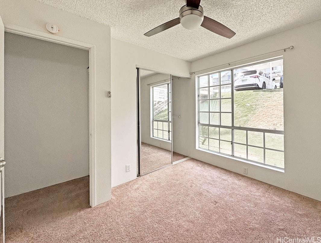 92-1150 Hame Street, Unit 8102 Kapolei, HI 96707 - Photo 17 of 19 a view of an empty room with a window