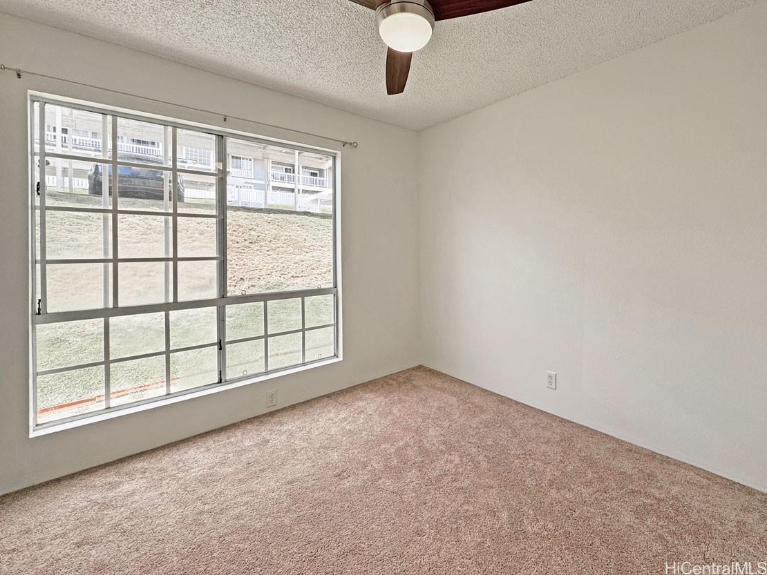 92-1150 Hame Street, Unit 8102 Kapolei, HI 96707 - Photo 18 of 19 an empty room with windows