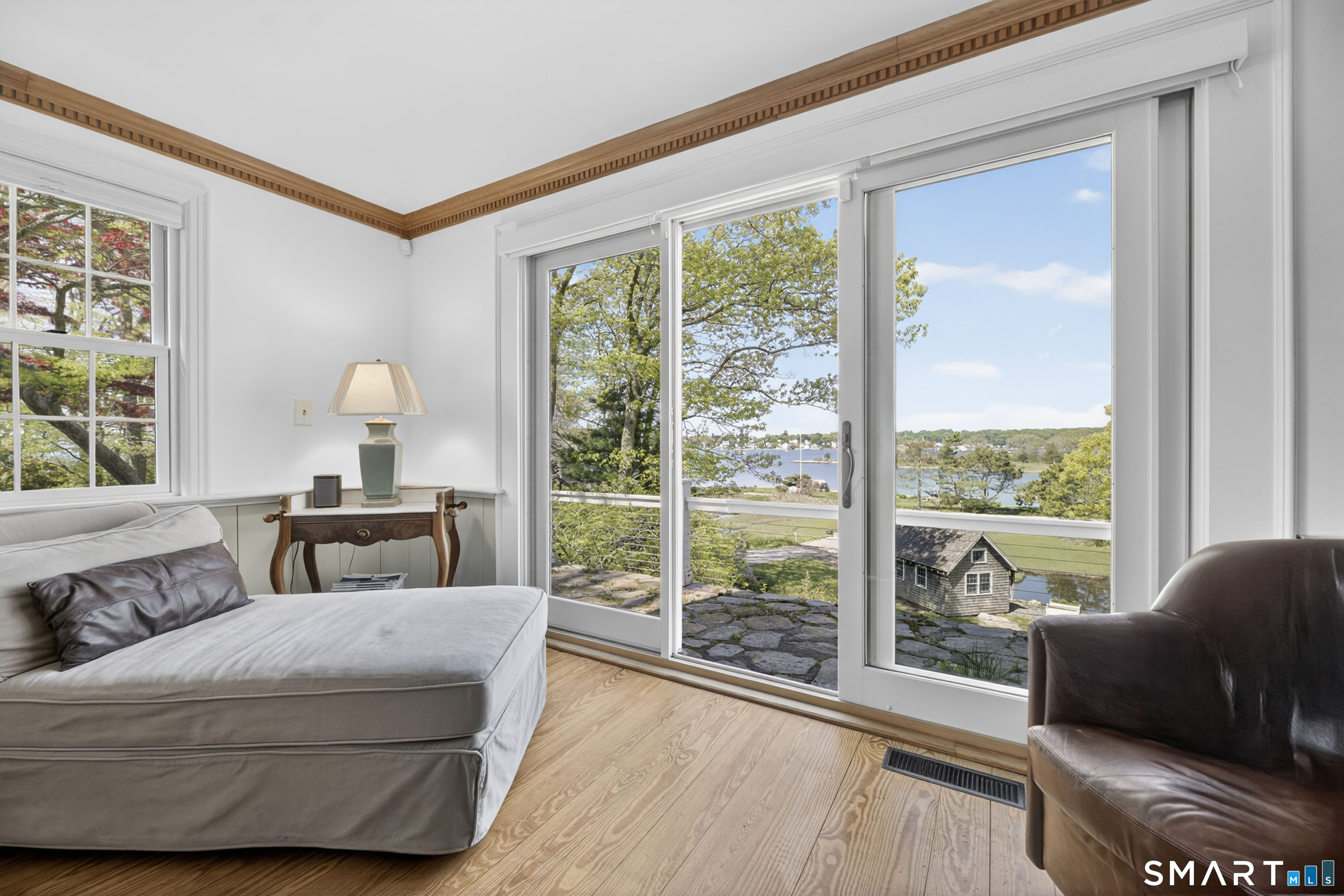 32 Money Point Road Stonington, CT 06355 - Photo 18 of 40 a bedroom with a bed and wooden floor