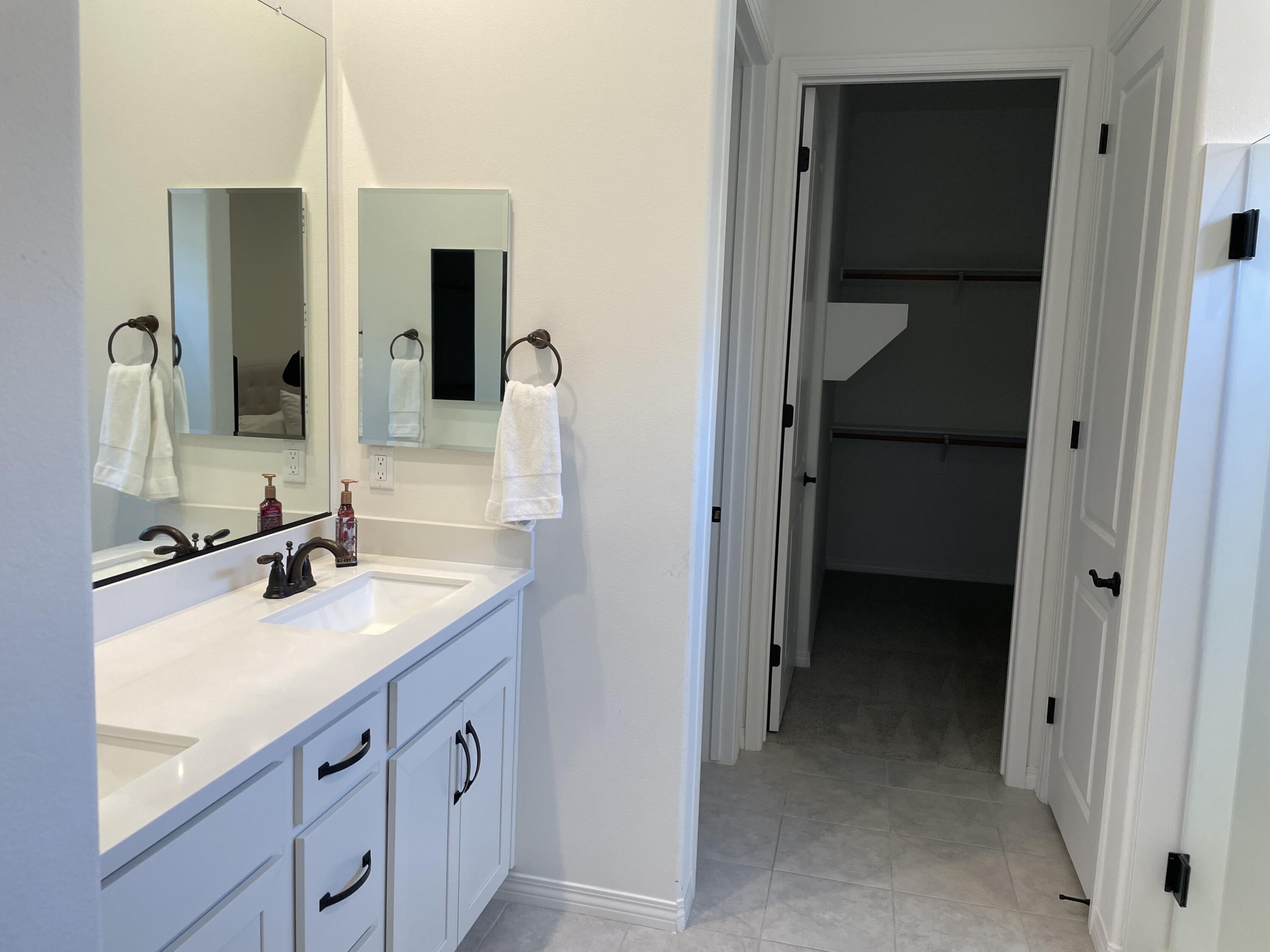 67 Cabernet Rancho Mirage, CA 92270 - Photo 11 of 17 a bathroom with a double vanity sink and mirror
