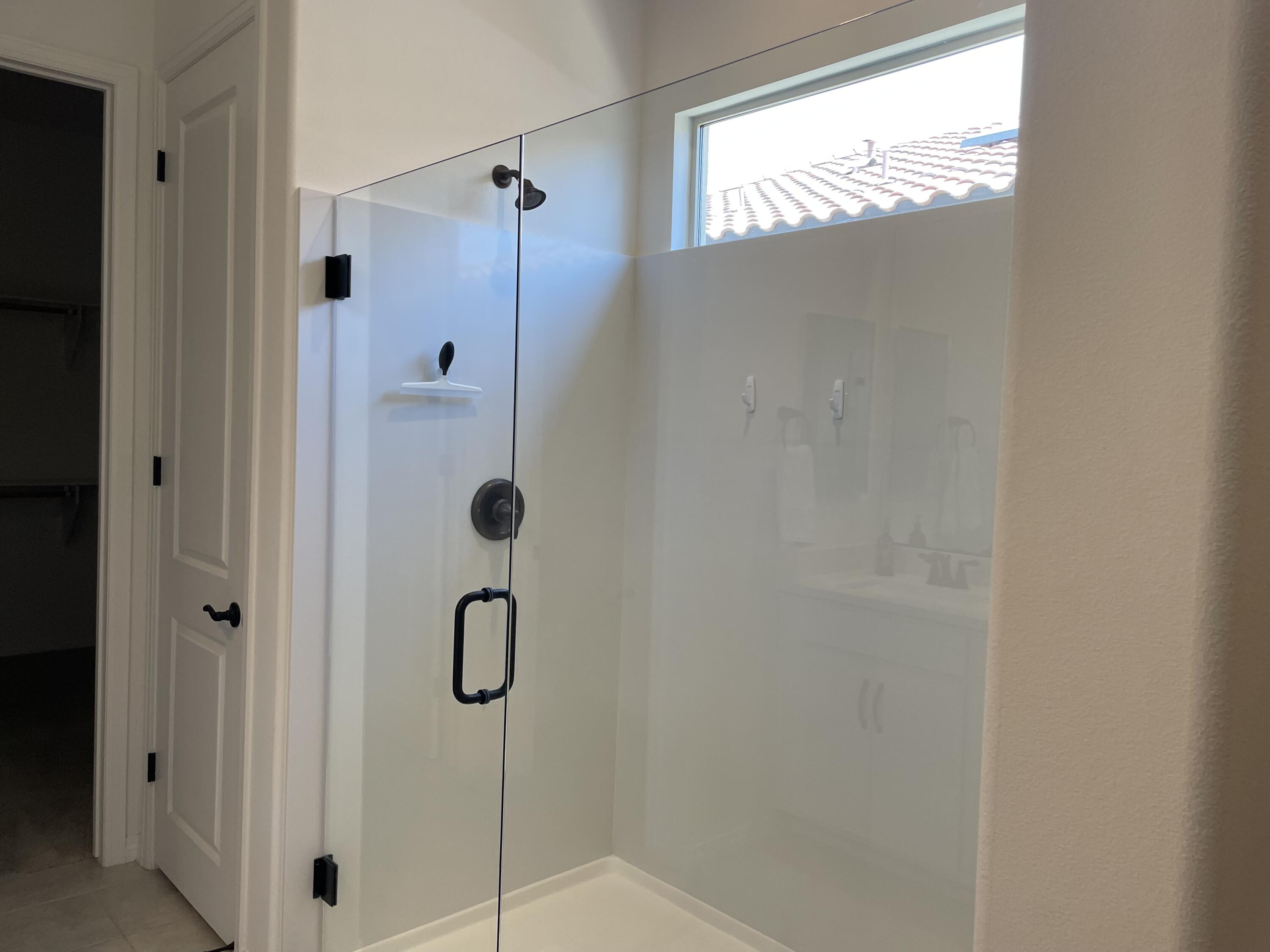 67 Cabernet Rancho Mirage, CA 92270 - Photo 12 of 17 a bathroom with a glass shower door