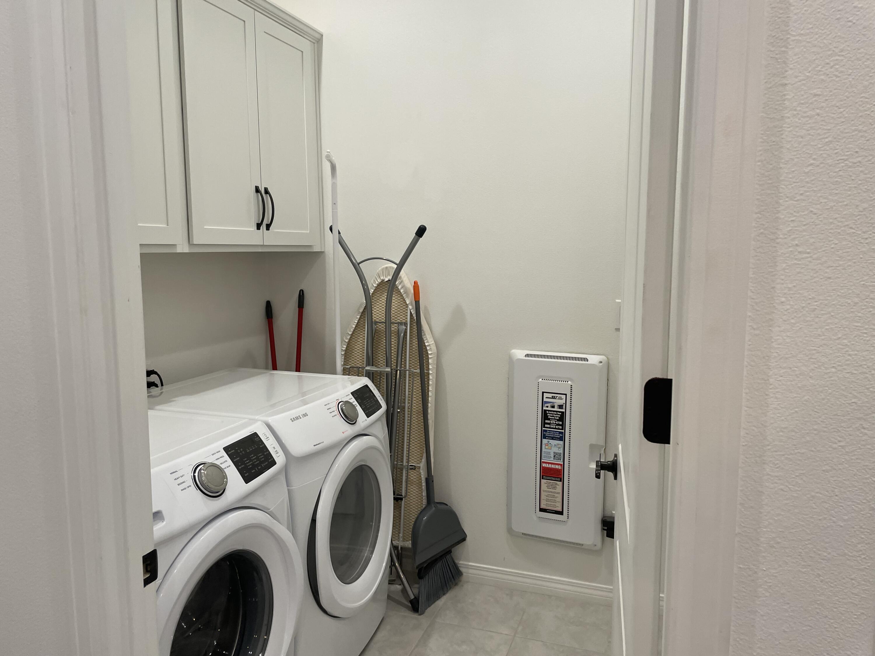 67 Cabernet Rancho Mirage, CA 92270 - Photo 14 of 17 a utility room with dryer and washer