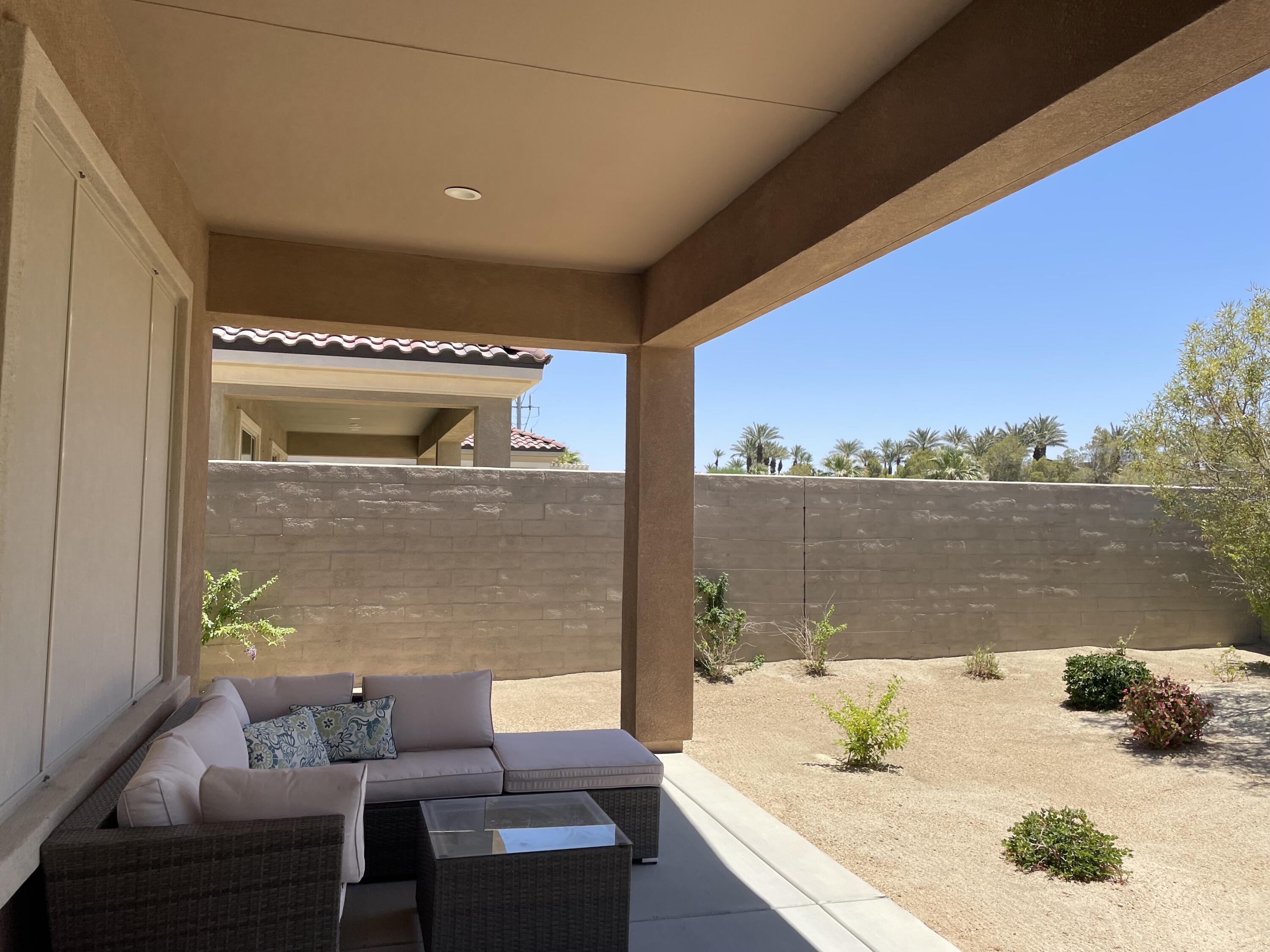 67 Cabernet Rancho Mirage, CA 92270 - Photo 17 of 17 a terrace with outdoor seating and water view