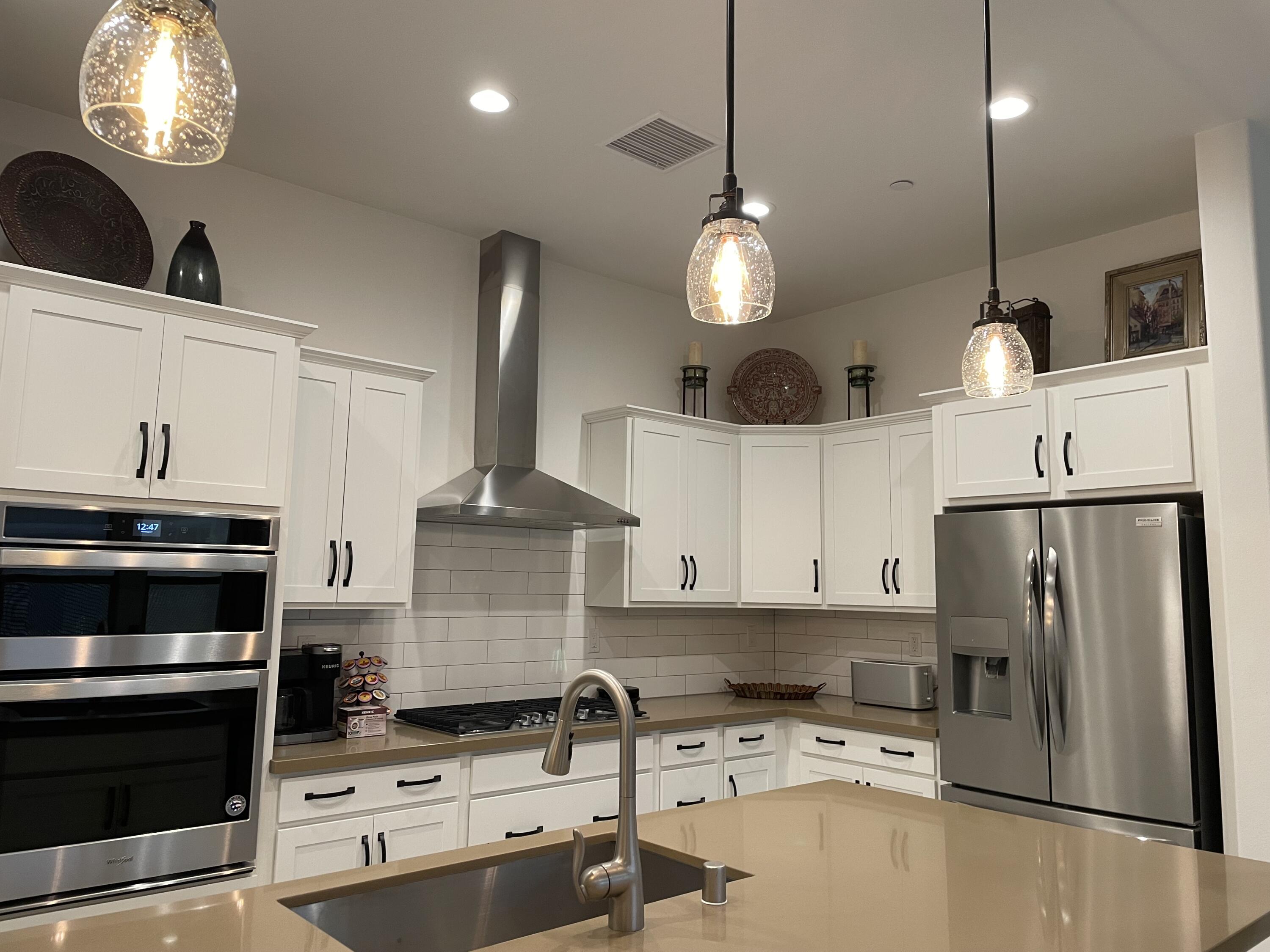 67 Cabernet Rancho Mirage, CA 92270 - Photo 5 of 17 a kitchen with stainless steel appliances a stove a refrigerator and a sink