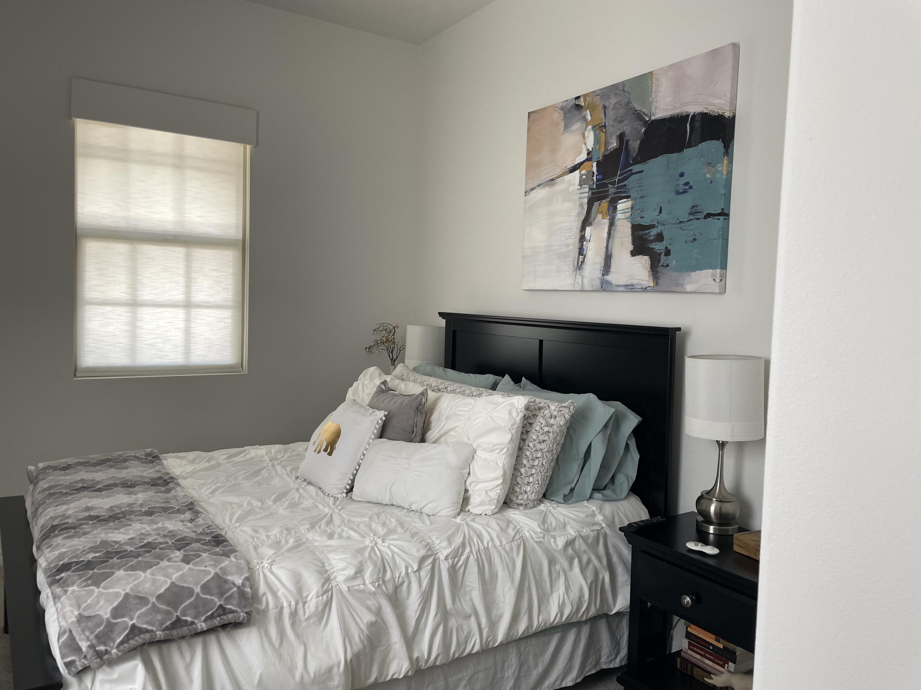 67 Cabernet Rancho Mirage, CA 92270 - Photo 7 of 17 a bedroom with a bed and a window