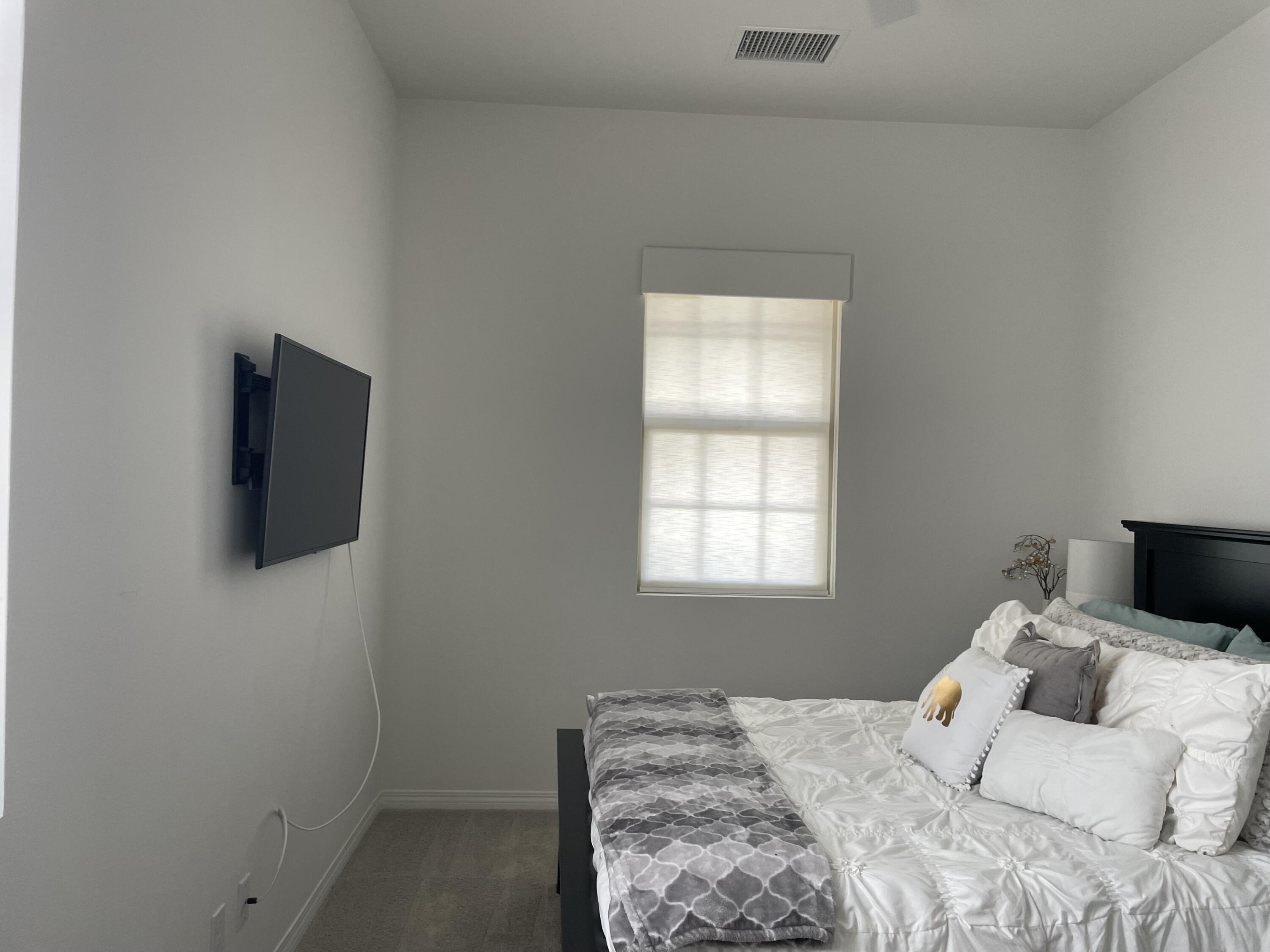 67 Cabernet Rancho Mirage, CA 92270 - Photo 8 of 17 a bedroom with a bed and flat screen tv