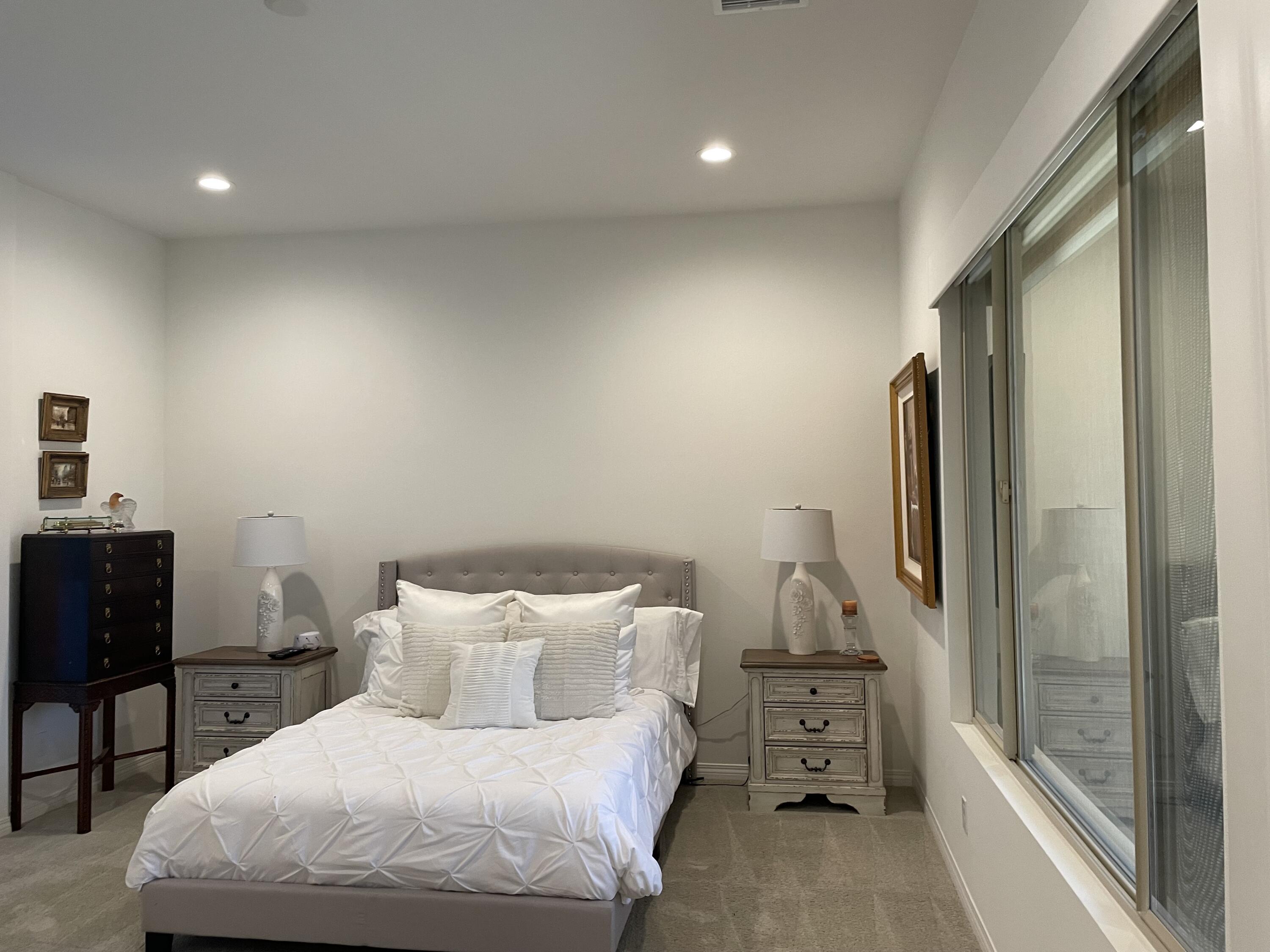 67 Cabernet Rancho Mirage, CA 92270 - Photo 9 of 17 a bedroom with a bed and a window