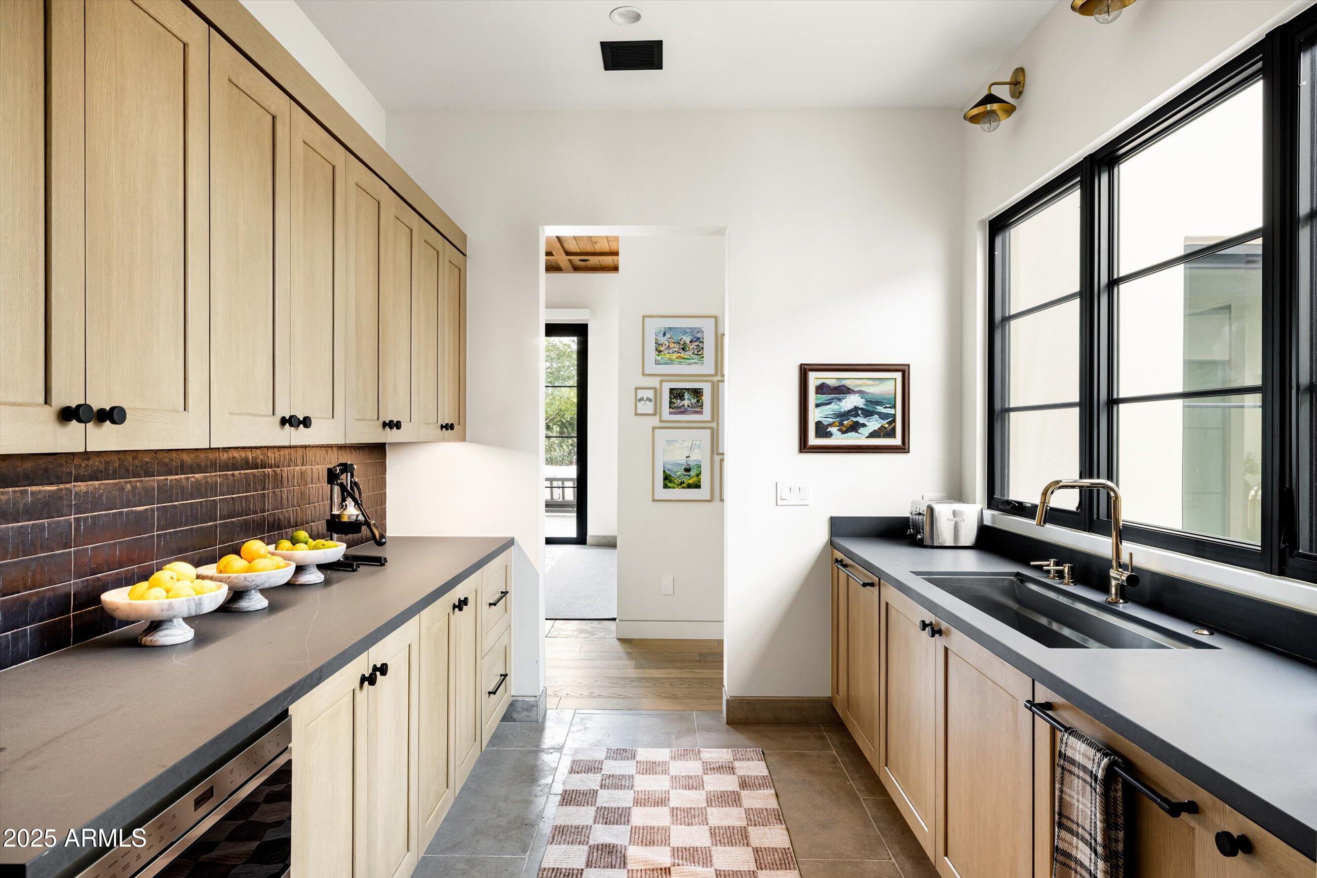 5715 East Monterosa Street Phoenix, AZ 85018 - Photo 11 of 113 a kitchen with stainless steel appliances a sink stove and cabinets