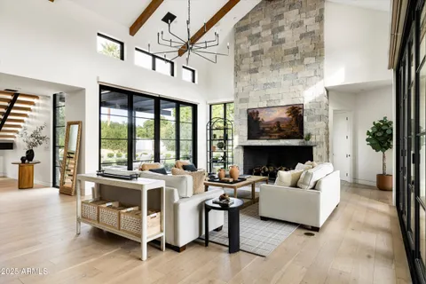 a room with a large window and a dining table