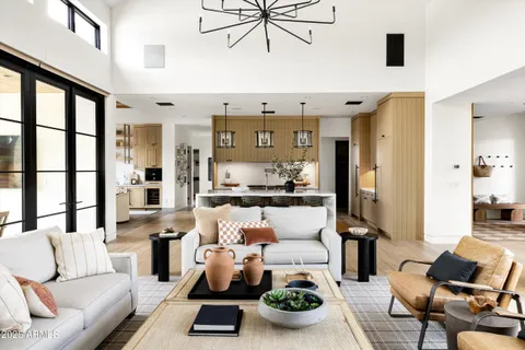 a living room with furniture a window and gym equipment