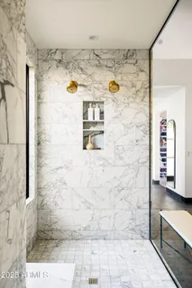 a view of a livingroom with furniture and a flat screen tv