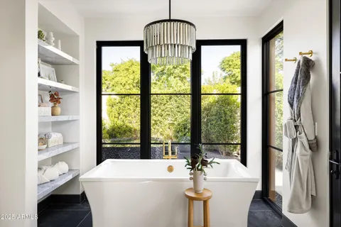 a bathroom with a toilet sink and a shower