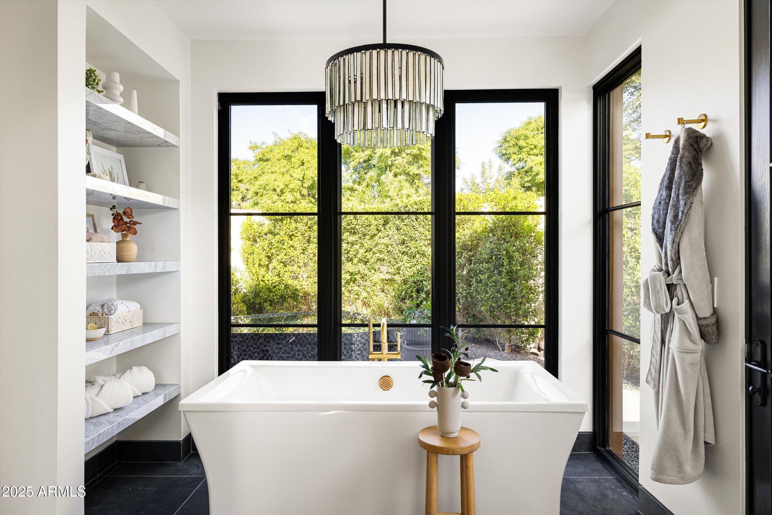 5715 East Monterosa Street Phoenix, AZ 85018 - Photo 24 of 113 a room with a large window and a dining table