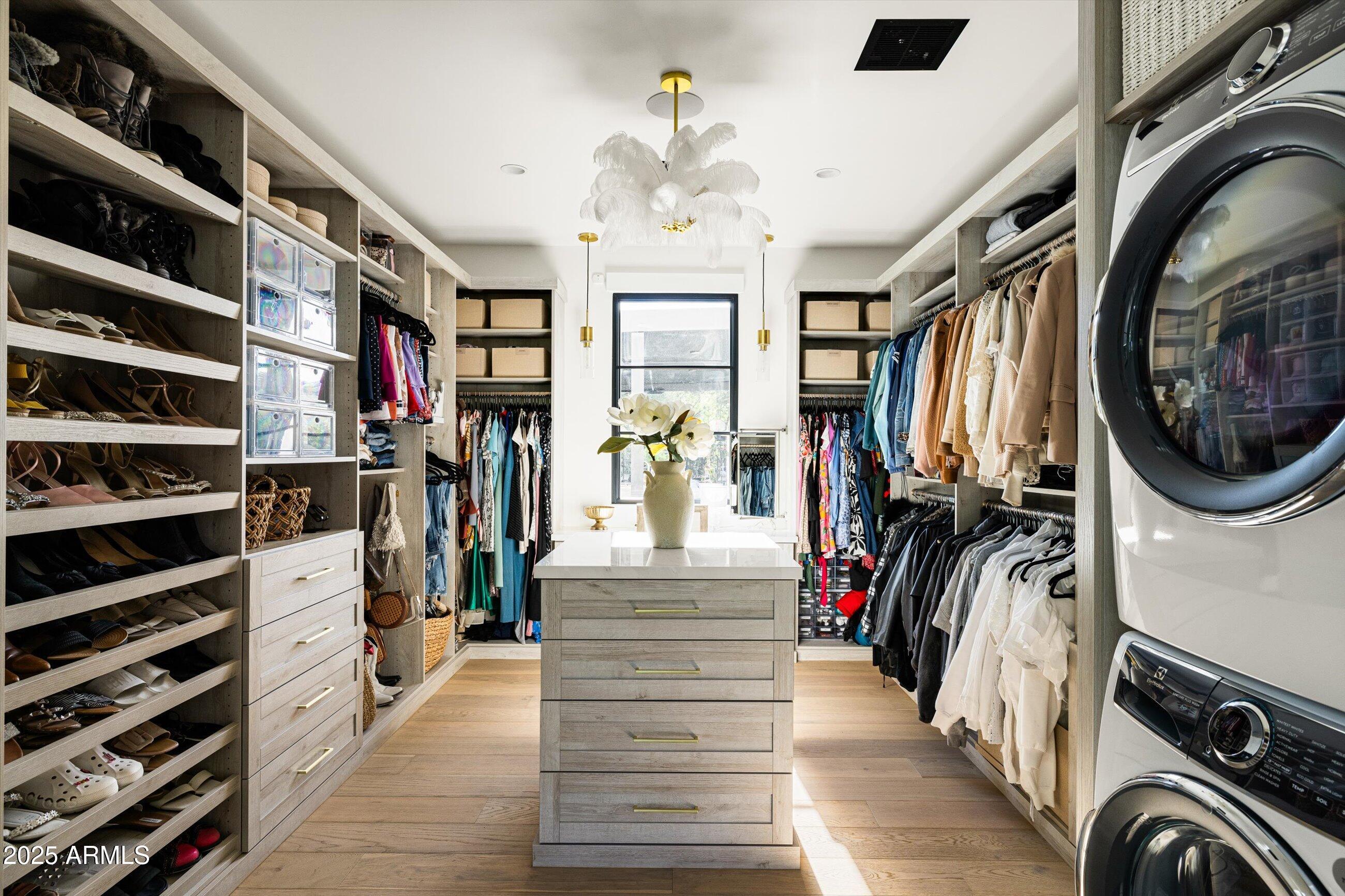 5715 East Monterosa Street Phoenix, AZ 85018 - Photo 25 of 113 a view of walk in closet with clothes and shoes
