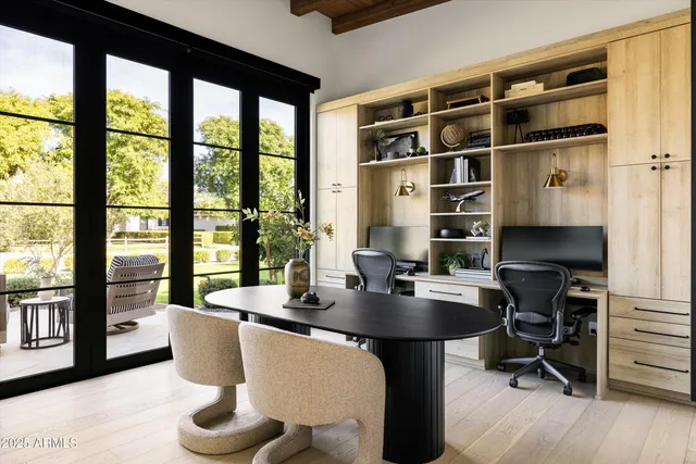 a living room with lots of furniture and a large window