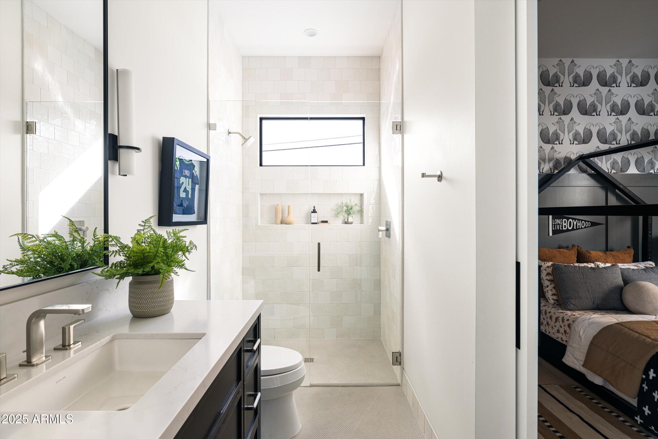 5715 East Monterosa Street Phoenix, AZ 85018 - Photo 31 of 113 a view of bathroom with a sink and mirror