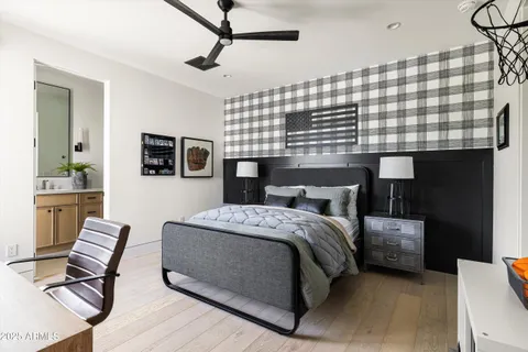 a living room with furniture a fireplace and a floor to ceiling window