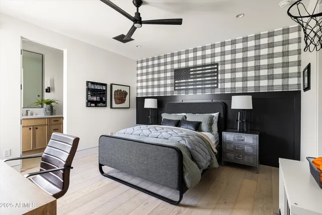 a living room with furniture a fireplace and a floor to ceiling window