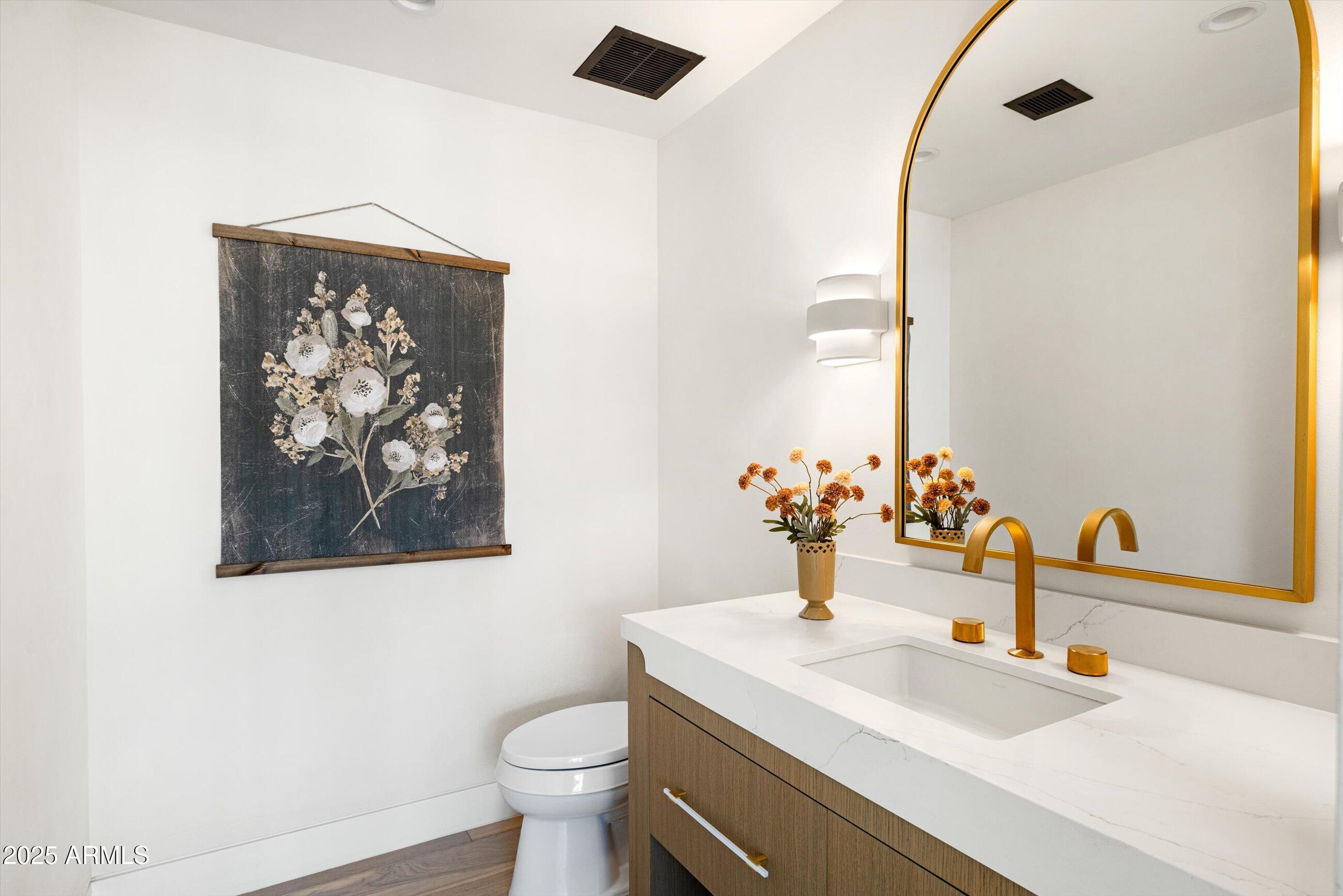 5715 East Monterosa Street Phoenix, AZ 85018 - Photo 41 of 113 a bathroom with a sink and a mirror