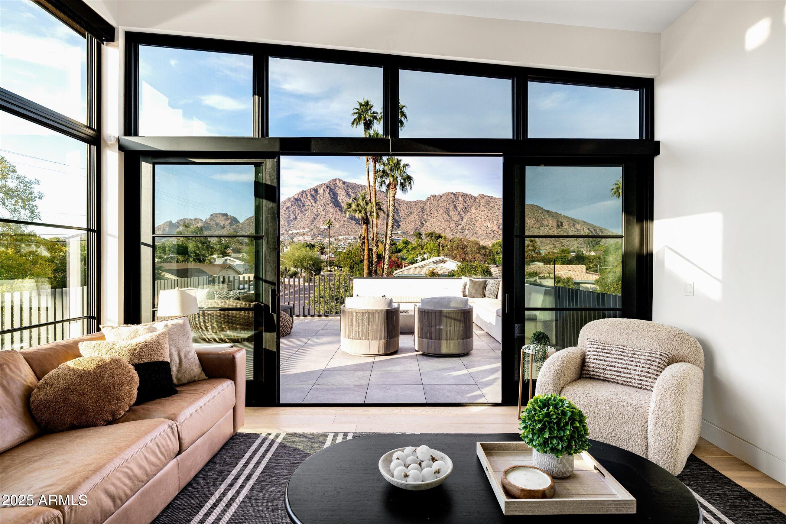 5715 East Monterosa Street Phoenix, AZ 85018 - Photo 44 of 113 a living room with furniture and a large window