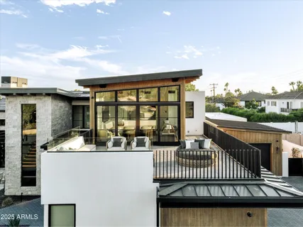 a view of a swimming pool with a table and chairs