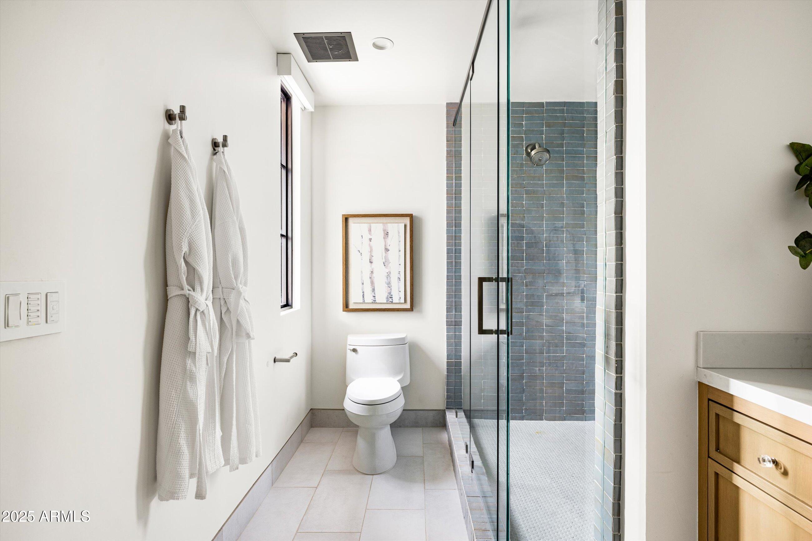5715 East Monterosa Street Phoenix, AZ 85018 - Photo 48 of 113 a bathroom with a toilet sink and a shower