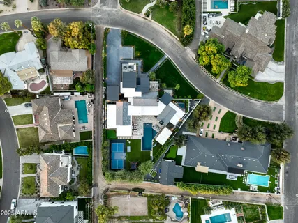 a view of a patio with table and chairs with wooden floor and fence