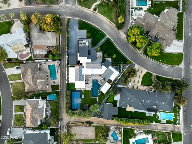a view of a patio with table and chairs with wooden floor and fence