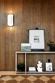 a living room with furniture large window and a fireplace