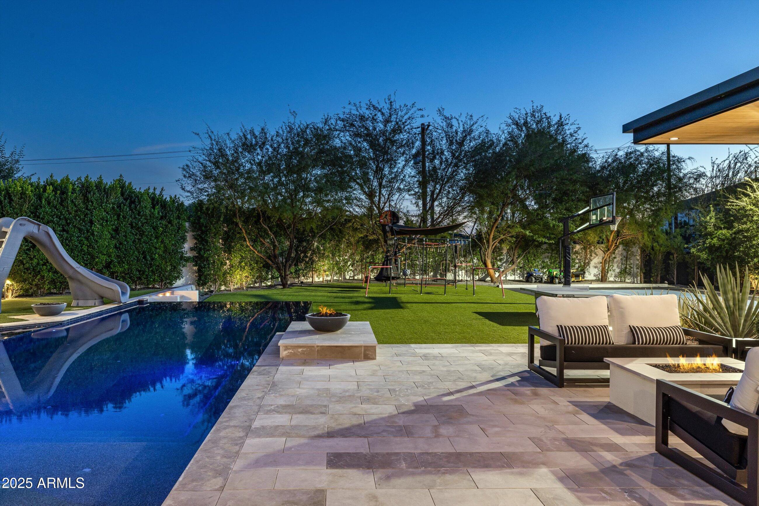 5715 East Monterosa Street Phoenix, AZ 85018 - Photo 62 of 113 a view of backyard with swimming pool and outdoor seating