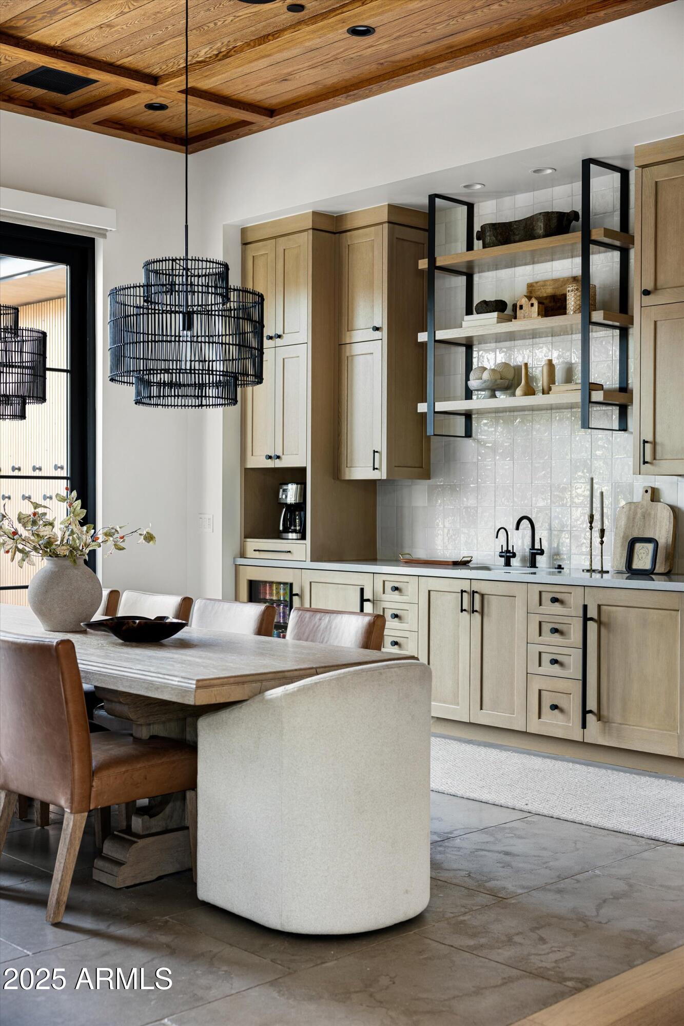 5715 East Monterosa Street Phoenix, AZ 85018 - Photo 80 of 113 a kitchen with kitchen island granite countertop a sink cabinets and stainless steel appliances